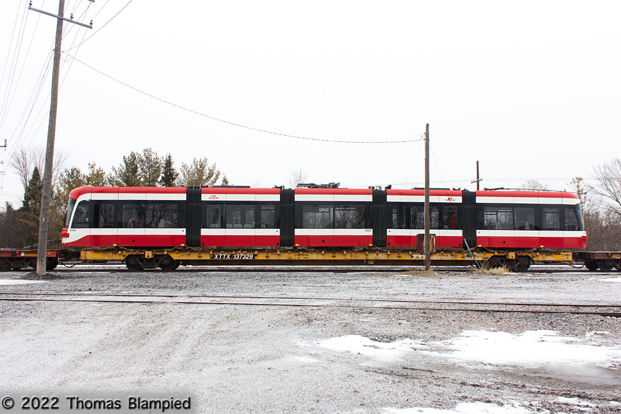 So close and yet so far. TTC streetcar 4458 sits in the siding at Whitby with two CP idler flats, still more than 20 miles from Toronto. My best guess is that the consist developed a fault and was set out. Amazingly, it sat here for almost three weeks.