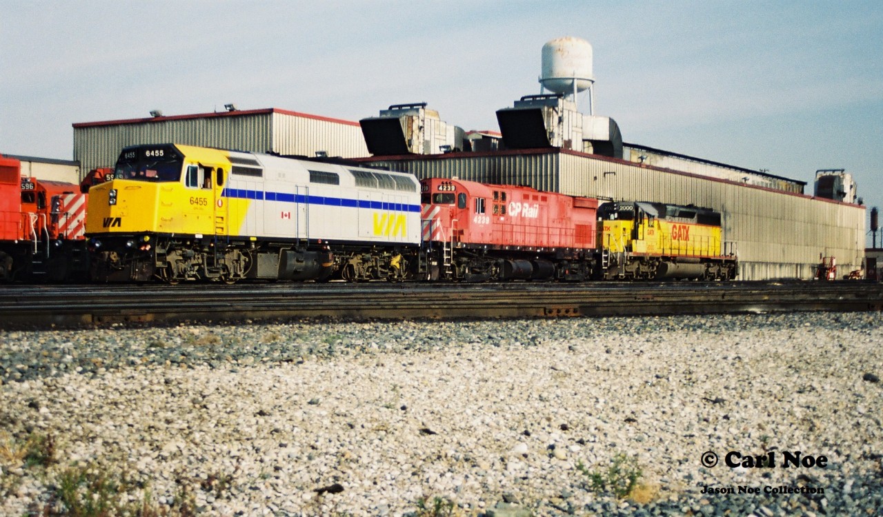 Leased VIA Rail 6455, CP 4239 and leased GATX 2000 are seen together at CP's diesel shop at their Toronto Yard during a fall morning in October 1994. Later that day, CP 4239 and VIA Rail 6455 would be assigned to train 923. 

http://www.railpictures.ca/?attachment_id=43903