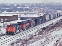 <br>
<br>
   While awaiting VIA #1, CN extra 9509 west leads two sisters ( 9648 9664) 'elephant style' towards Mac Yard.
<br>
<br>
   The ubiquitous GMD 1974-6 built  GP40-2L(W), CN owned 278 examples.
<br>
<br>
   At Yonge Street, January 17, 1987 Kodachrome by S.Danko

