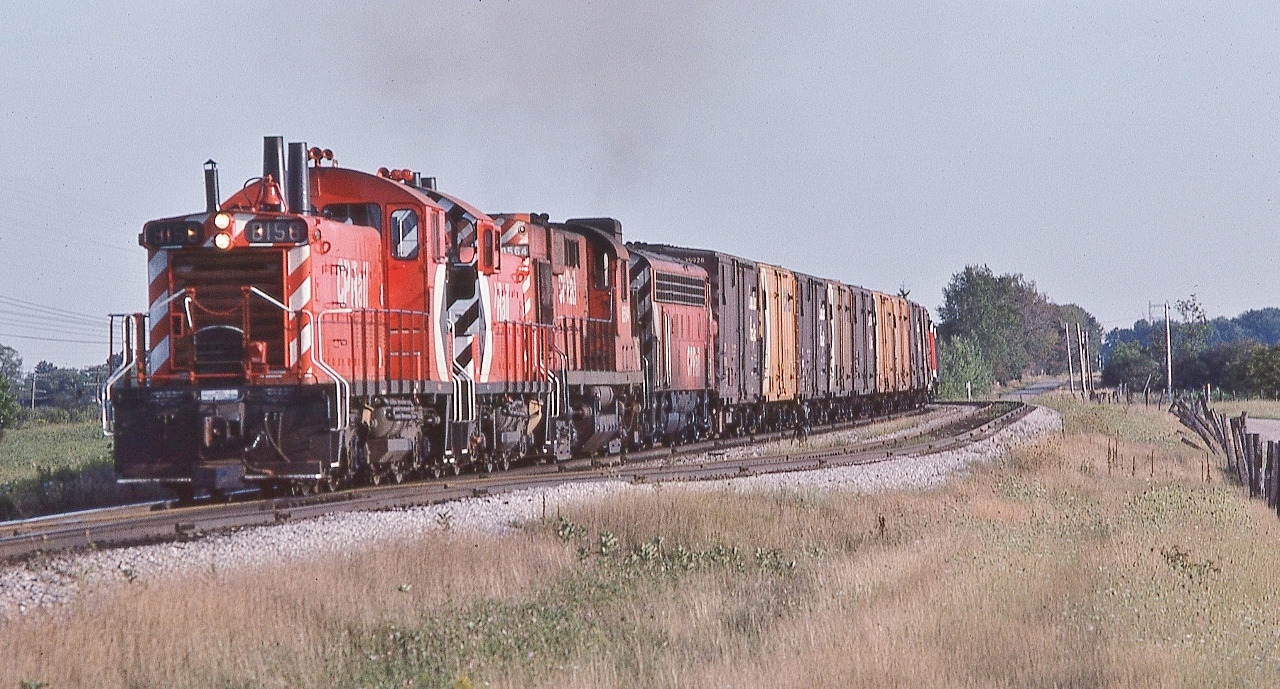 While waiting for CP Rail #11 ….


   … the eclectic CP ...


   CP Rail power lash ups circa 1978 – these type of scenes are what made us look for more !


   two GMD 1960 built SW1200RS'S; a MLW 1958 built RS-10; a GMD 1950's built FP7A 


   8156 – 81xx – 8564 – 40xx


   'Highballing' North: daily CP Rail #955 near Kleinberg, August 26, 1978 Kodachrome by S.Danko


   interesting: 8158's third stack is the watch man heater, essentially an engine block heater: fueled by oil (diesel).


   Only about twenty five (of 72) 8100's were: “equipped with safety devices to operate in the lead position”
  

   and seems to me that this location is near the present day intermodal facility.