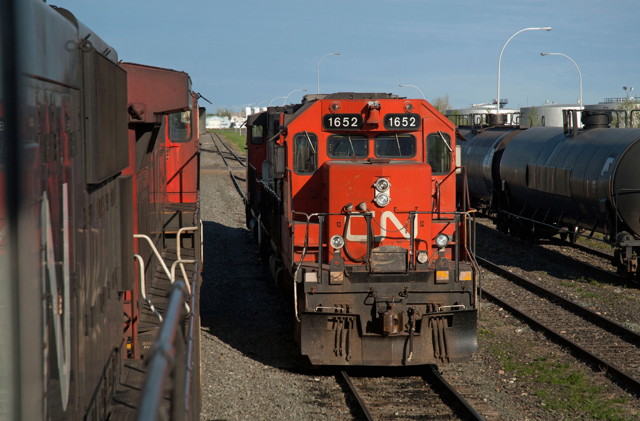CN 507's power is seen tied down at the west end of the yard in Lloydminster Alberta. The exNAR SD38-2s were regulars on the 507 at this time. Viewed from the the second unit on the daily A411 out of North Battleford.