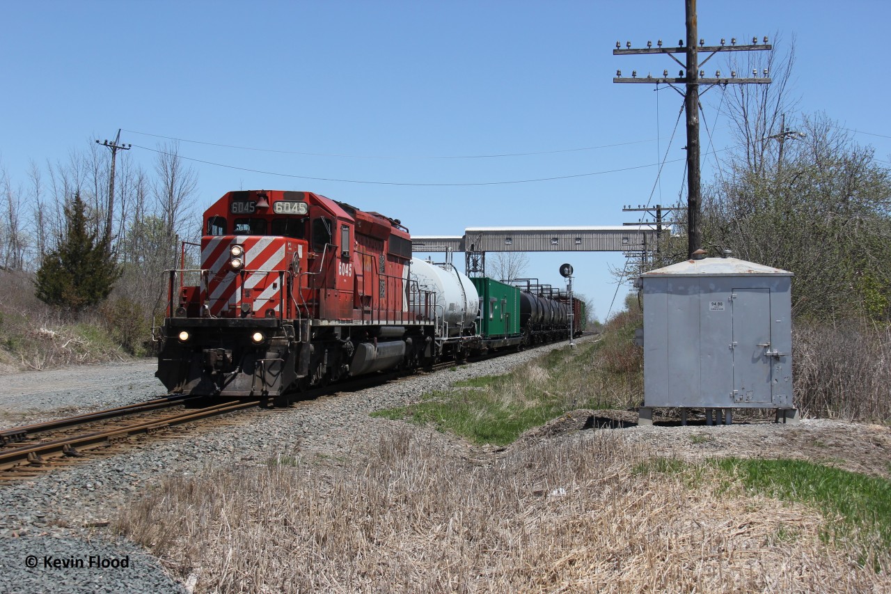 The Spring 2020 Canadian Pacific Southern Ontario weed spraying train was back underway westbound at Zorra Station after being held for a few hours due to a track block starting from this location – mile 94.86 Galt Sub (work at this crossing if I recall correctly). The train was way earlier than I was hoping for that day, and at this point, the sun was finally shifting in favour of westbounds. Folks down in the Windsor area had the best light that day. Also of note is the structure in the background, which is now removed, making this my first and last shot of a train at this location (I doubt I’ll be back there again). SD40-2 #6045 provided the power.