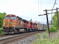 A nice leader on CP 234 this morning as BNSF Dash9 5340 in H2 paint leads a former SOO and CP GP38  through Streetsville. 