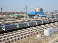 Winds of change. Here we see a number of retired GO Transit F59PH’s sitting covered with tarps in the VIA yard awaiting shipment to their new owners, while new MP40PH’s sit beyond in GO’s yard.  Today all the F59’s in the foreground have found new homes scattered across North America at varies commuter agencies.