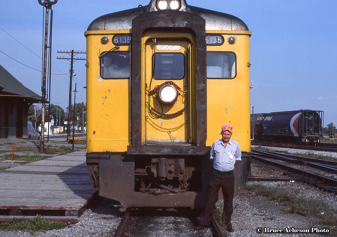 The engineer on VIA Rail 189 poses in front of his pair of Budd RDCs at Havelock before departing on the second last run to Toronto.  The final westbound run would take place the following day, Monday, September 6, 1982.  In a few years time, the Havelock train will be reinstated on June 3, 1985, before being cut for good in January 1990.More of the “Havelock Budds”:Havelock, July 1976, Arnold MooneyBurketon, July 1976, Doug HatelyHavelock, August 1977, Arnold MooneyA series of shots by Steve Danko, showing the second last run, September 5, 1982:Arriving PeterboroughPulling down the shoe flyThe platform scene at PeterboroughToronto-bound through PontypoolLast Day at Peterborough, Eric MayHavelock after the return, August 1986, Steve Danko