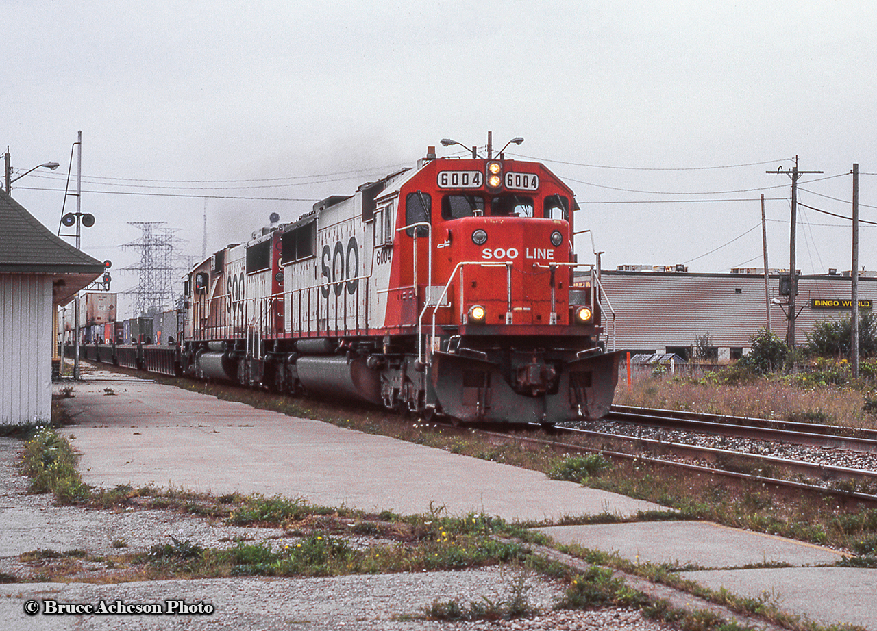 Headed for the connection with the Canpa Sub, a pair of SOO SD60s take an intermodal eastbound along the Oakville Sub by Burlington West station.