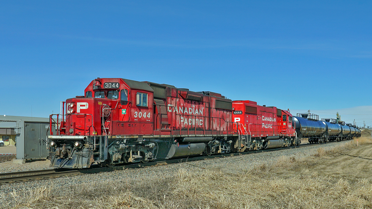 SD38-2s CP 3044 and 4444 (ex SOO) head west on the Scotford Sub with a transfer of tank cars from Clover Bar too Lambton Park.