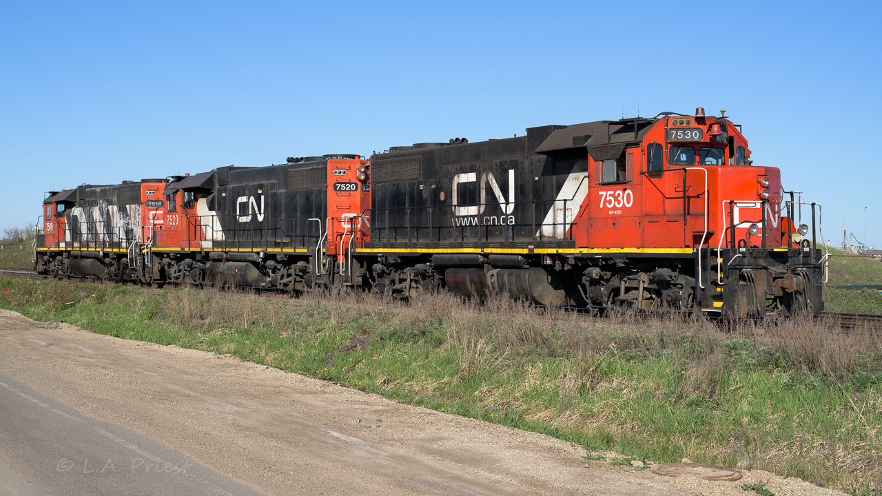 After doing some work in the East Edmonton area, these 3 are returning to Clover Bar yard. They look like the 3 Musketeers, each with its own version of CN livery.