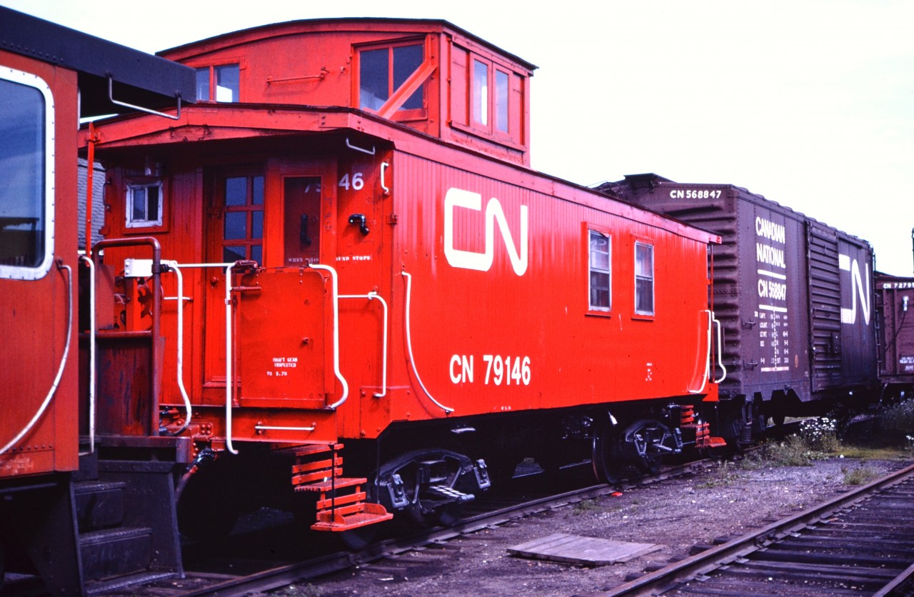 Viewed from the opposite end to the photo submitted by First954 a few days ago, here is CN 79146 in Capreol on one of the shop tracks sporting a fresh coat of paint in the summer of 1976. It was not in the consist of the Capreol Auxiliary outfit at the time of this photo, but likely ended up there after being outfitted for service.