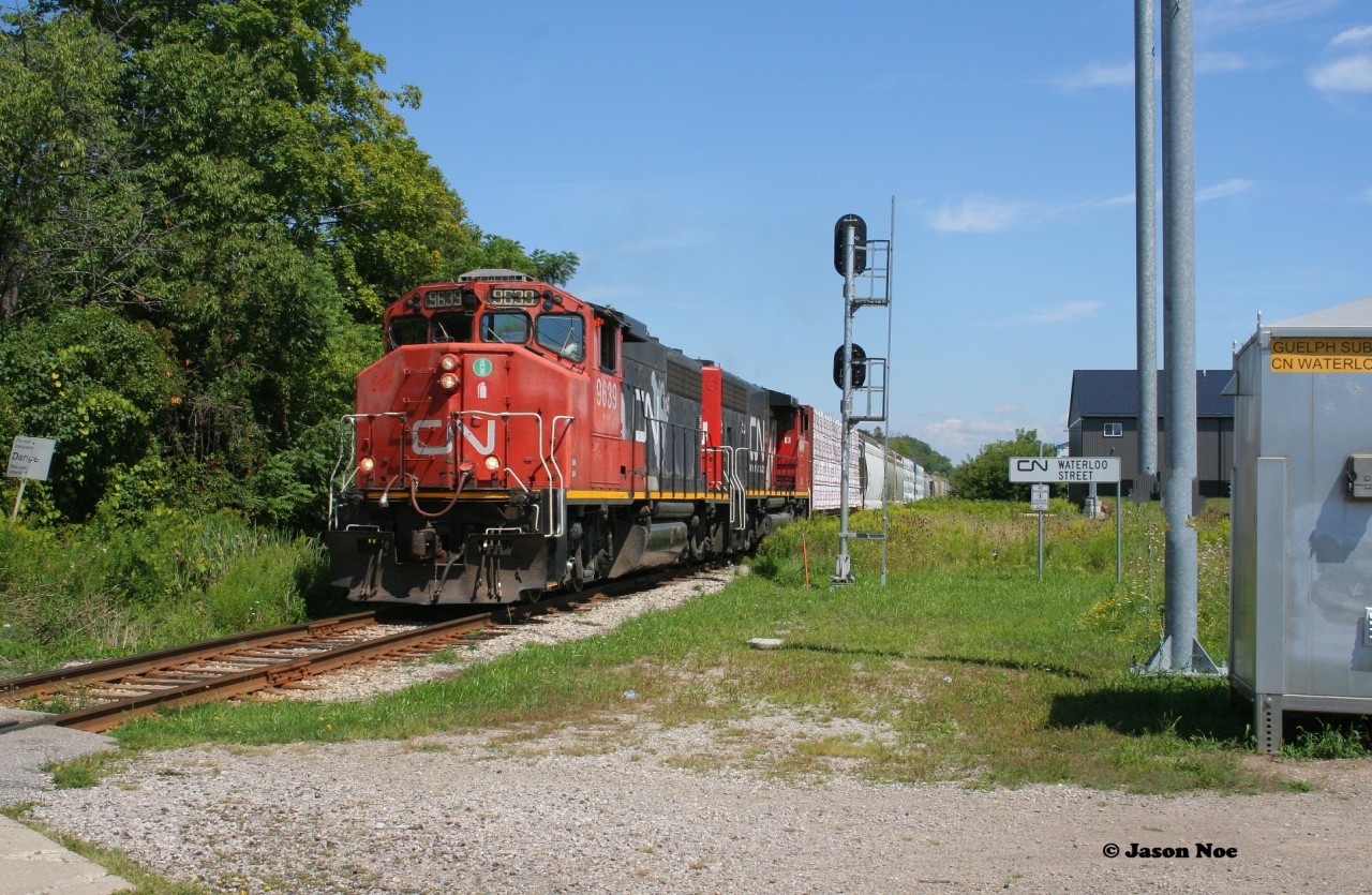 CN L568 with 9639 and 9449 head westbound at Waterloo Street in the town of New Hamburg as the vintage pair of widecabs head to Stratford on the Guelph Subdivision.