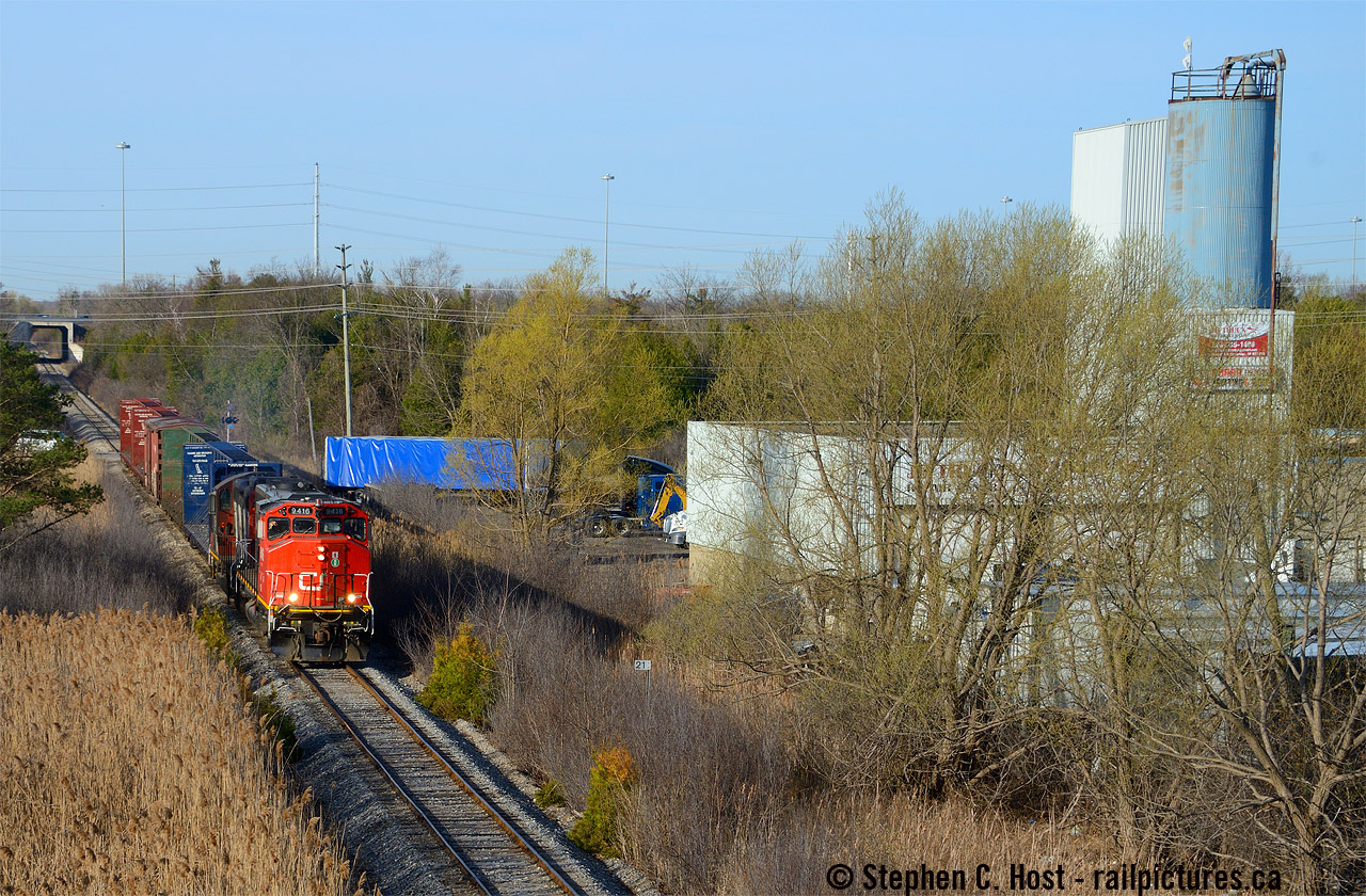 CN L542 seen blasting off at a blistering 10 MPH on the old Fergus sub heading for Guelph, passing one of the old factories that dot the landscape. On the other side of the factory was the former Grand River Railway Hesleper Sub (CP) that is now removed. Wonder if this place had rail service? As for the train, while it may look unremarkable to the average 'fan on this site, this was a very rare occurrence according to local historians - a CN GP40 running on the Fergus? Almost unheard of. I can think of a few occasions in the GEXR days when either a leased CN GP40 set off or lifted cars in Guelph (432) on the Fergus or GEXR 3030 was assigned to 582, but apparently CN didn't send the big power on this branch before the GEXR takeover in '98, and since the takeover this was apparently the first time.. comment below folks who may have a rebuttal or evidence to this effect! tx.