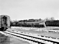 Extra 4094 West, with 8477, pulls through the yard at Sudbury, Ontario in early December 1968 as train #2, the Canadian, is switched.