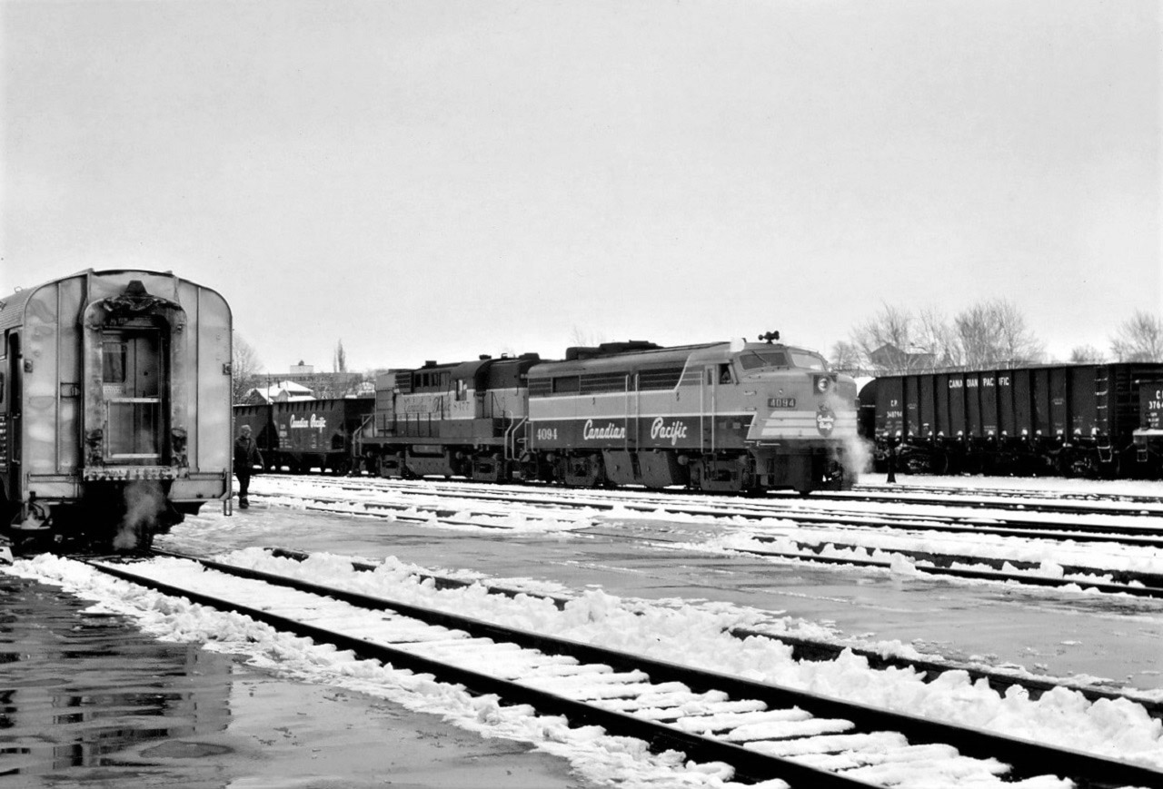 Extra 4094 West, with 8477, pulls through the yard at Sudbury, Ontario in early December 1968 as train #2, the Canadian, is switched.