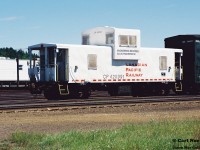 CP Engineering Services caboose 420991 is seen at Cartier, Ontario in the CP yard during the summer of 2000. 