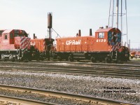 CP SW1200RS 8139 and SD40 5530 pause between assignments at CP's Toronto Yard diesel shop in the summer of 1994. 