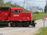 CP T78 is seen shoving to set-off four hoppers at the FS Partners facility switching over Greenfield Road in Ayr, Ontario on the Ayr Pit Spur with 2269 and 2259.