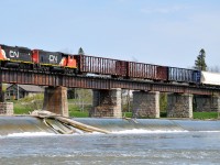 Having completed their switching at Nicholson & Cates, L58031 10 is now starting across the Grand River with GTW 6425 and CN 4798 leading 20 cars