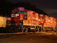 On a clear night at Kinnear CP GP9u 8233, CP GP9u 8200, and CP GP38-2 3017 ilding in the yard waiting for their next assignment.
