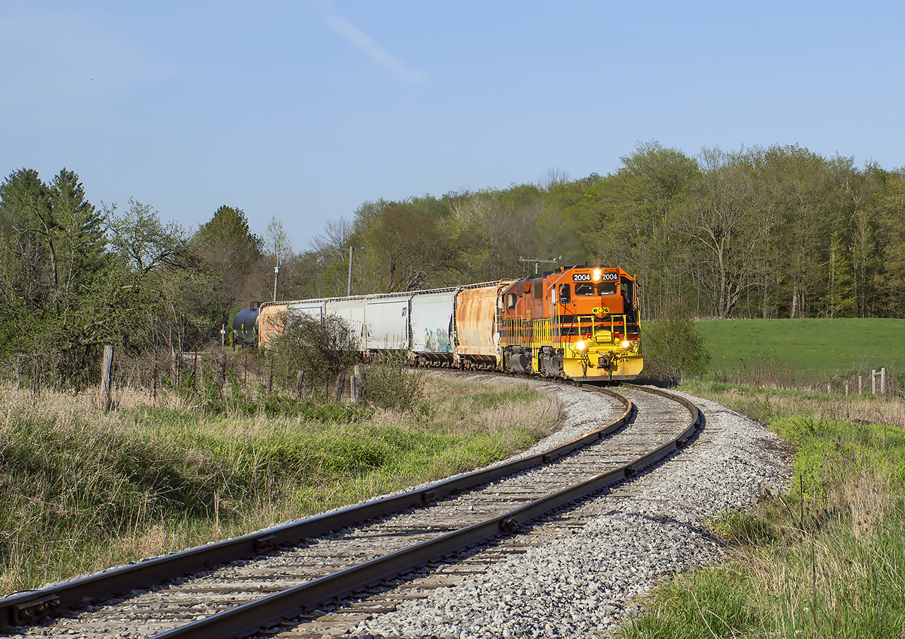 583 heads for Guelph to work around the St. Patrick's Ward neighbourhood.  South of Corwhin, they are approaching the crossing known as "Danger Bell" in reference to the style of crossing protection used here in years past which featured a flashing "DANGER" sign.