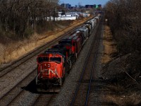 CN 527 is approaching Taschereau Yard with an SD75I and a Dash9 for power.