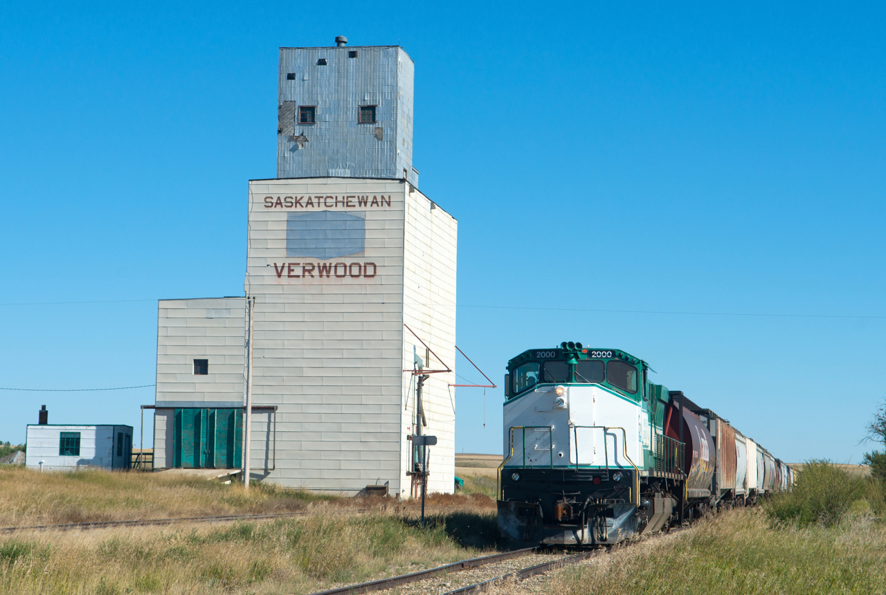 There is no work at Verwood on this picture perfect September day as GWRS 2000 slowly makes it's way home to Assiniboia with grain loads from Ogema in tow.