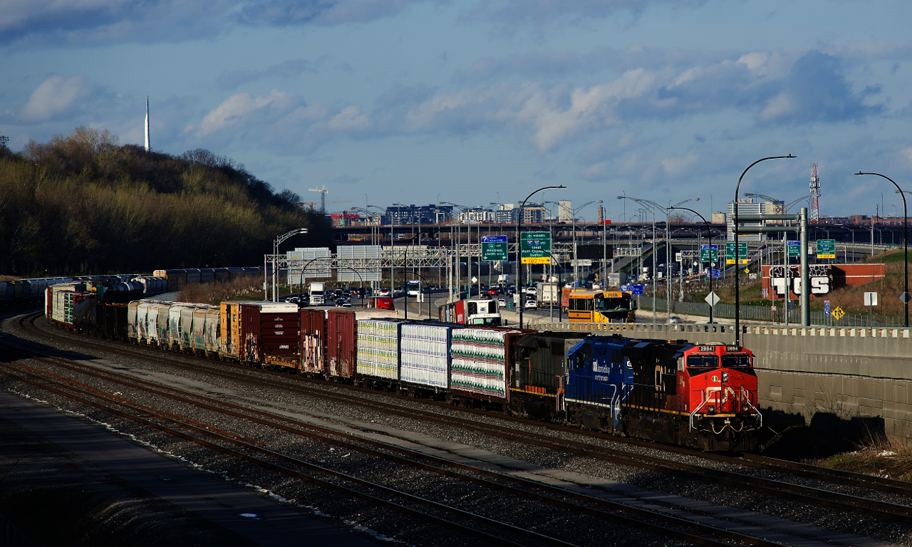 CN 401 has blue and grey power trailing as it slowly approaches Turcot Ouest with CN 2894, CN 4905 (ex-GMTX 2260) and QGRY 6908. The latter is being transferred from the Quebec Gatineau to the St. Lawrence & Atlantic.