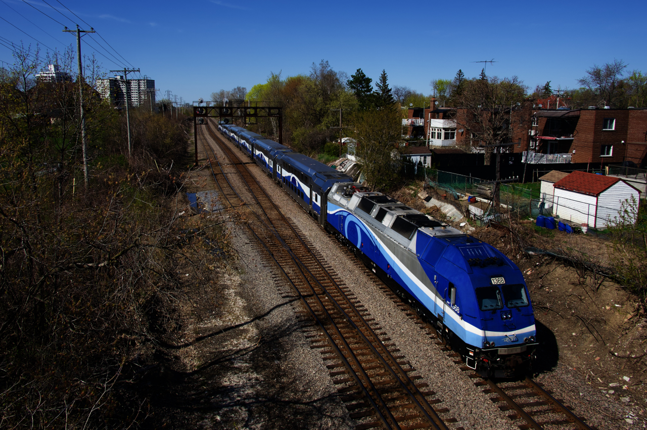 The first departure of the afternoon from downtown Montreal for Saint-Jérôme has just taken the North Jct Lead to get from the Westmount Sub to the Adirondack Sub as it approaches a vintage signal bridge.