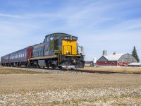 Upon leaving the Kitchener train show I figured I'd pop by Lancaster Street to see what CN was up to.  Rather than CN, the scanner picked up Waterloo Central 1012 shoving towards Elmira just a few miles to the north.  Catching up with the train, it is seen trundling through mennonite country just south of Elmira, passing the Henry H. Martin farm.