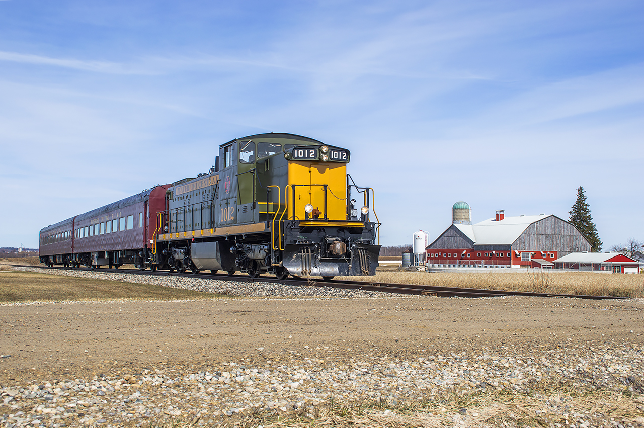 Upon leaving the Kitchener train show I figured I'd pop by Lancaster Street to see what CN was up to.  Rather than CN, the scanner picked up Waterloo Central 1012 shoving towards Elmira just a few miles to the north.  Catching up with the train, it is seen trundling through mennonite country just south of Elmira, passing the Henry H. Martin farm.