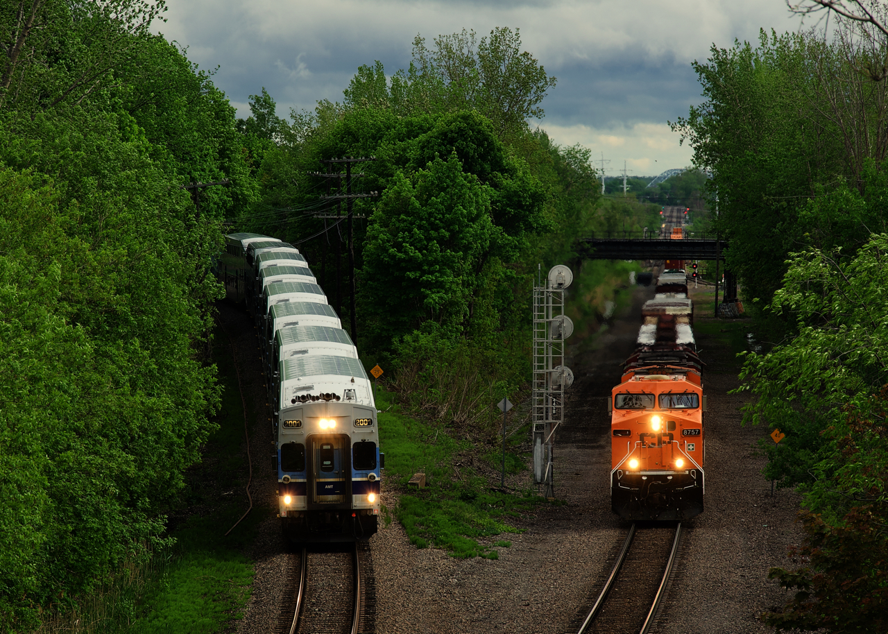 Both EXO 185 and CP 223 are heading in the same direction as the commuter train drops down the North Jct Lead and CP 223 passes on the Adirondack Sub. The Every Child Matters unit (CP 8757) leads CP 223 and is missing one numberboard after tangling with a downed tree earlier in the day. EXO 185 has a bilevel consist; EXO only has 22 bilevel cars, versus 160 multilevel cars.