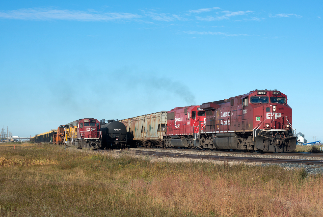 CP 602 rolls into the cautionary limits at Foot on the Indian Head Sub with 8055 and 6300 on the point.  At left is a CWR train waiting for a crew to taxi in from Moose Jaw with 5856 and 3712 for power.  I like scenes where the EMDs outnumber the GEs.