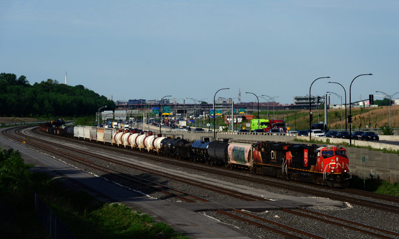 CN 100 unit CN 3887 & CN 2253 lead a short CN 321 towards Turcot Ouest. With only 55 cars, they will be lifting cars at Coteau and Brockville. In just a a mile or two they will be stopped by a PTC penalty, an odd thing to happen in Canada, where PTC is not used.