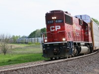 Not a shot I get too often. A bit unusual to see a SD60 running long hood forward. The hope was to intercept train 137 around Wolverton but that wasn’t in the cards as we apparently missed it. SD60 6307 was a decent consolation prize as it headed from Pender back to Wolverton with a decent cut of racks filled with RAV4’s as it rounds the curve at Innerkip. 