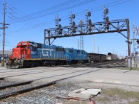 CN 554 backs across the Chartwell Road crossing while doubling its train prior to departure with 20 cars of general freight and 47 autoracks. Power today is GTW GP40-2 6420 (originally a DT&I unit) and CN GP38-2 4906 (the former GMTX 2273, previously LLPX 2244, originally built for the Long Island Railroad in 1976 as its 264).
CN 554 is normally ordered for 12:00 noon and typically departs about 90 minutes later.