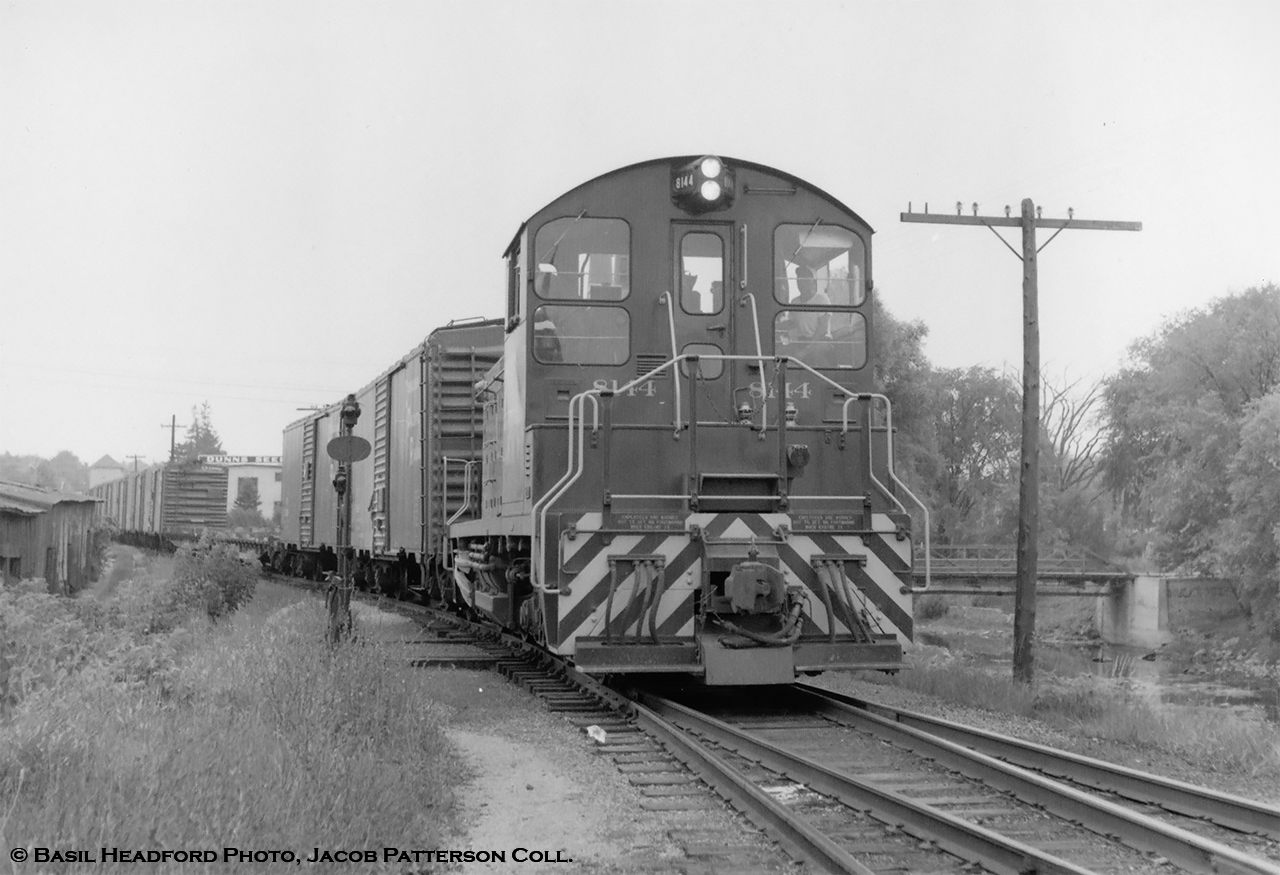 The Last Mixed, Part 2. On Saturday, August 4, 1962, four railfans from the Upper Canada Railway Society, including Basil Headford, boarded Canadian Pacific Mixed train M741 at Guelph headed northwest to Goderich on what was the final run of southern Ontario’s last CPR mixed train.On the Goderich Sub, through Passenger service from Hamilton to Goderich (daily except Sunday trains 637/640 per 1954 timetable) ended in 1955, with service south of Guelph Junction to Hamilton cancelled.  During the 1930’s, this run was usually held by gas electric 9007 and a trailer as seen in this March 1939 image at Guelph.  Guelph Junction – Guelph Service remained typically using gas electric 9004 until April 26, 1958, when service was cut from six round trips per day to two round trips, and the doodlebug would be swapped for a mikado and combine.  Months later in fall 1958, this too would be replaced by a mixed train, which in turn would be cut in the fall of 1960, leaving just the mixed north of Guelph.Here, CPR 8144 arrives back at Guelph with the last M742.  The siding switch has been lined for the station platform and once the train is spotted at the station, CPR mixed train service in southern Ontario will be history.  At right the Norwich Street bridge crosses the Speed River, and a portion of the Dunn Seeds plant can be seen on Cardigan Street.  An article detailing the trip appeared in the September 1962 UCRS newsletter: found here.CPR 8144, built by GMD in 1959, rebuilt to CP 1239 in 1981, retired 2012, sold to Independent Diesel Services of Minnesota.Part One: Setoff at MillbankBasil Headford Photo, Jacob Patterson Collection.