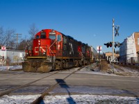 After a day of working around Guelph and Kitchener, 542 shoves two cars lifted from Traxxside into the what's left of the old Guelph siding, before departing light engines down the Fergus spur for Hespeler. Late afternoon winter light is my favourite, so I made sure to soak that up while watching these veterans do their thing on the same steel they would have decades on decades ago.  