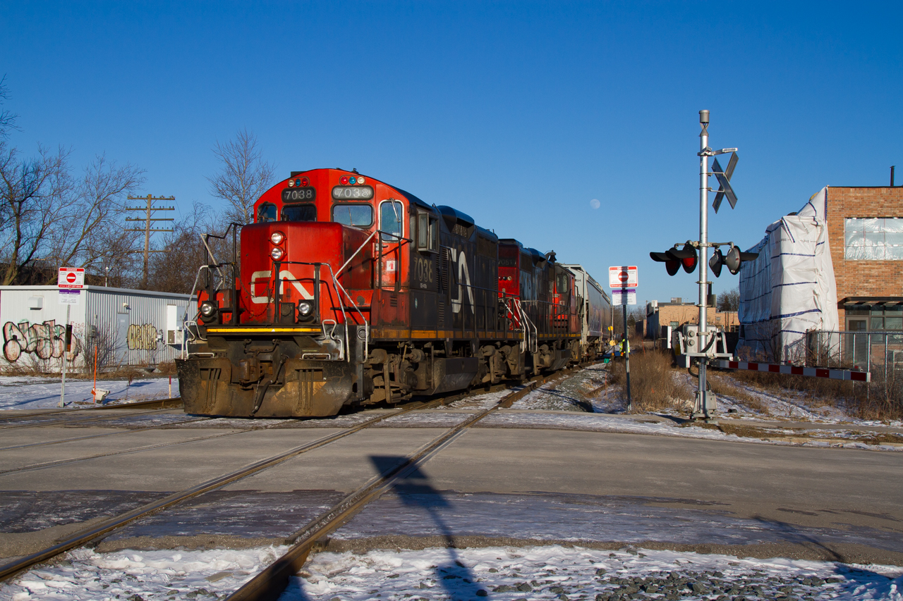 After a day of working around Guelph and Kitchener, 542 shoves two cars lifted from Traxxside into the what's left of the old Guelph siding, before departing light engines down the Fergus spur for Hespeler. Late afternoon winter light is my favourite, so I made sure to soak that up while watching these veterans do their thing on the same steel they would have decades on decades ago.