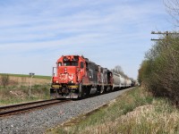 I was returning home and went by the Guelph version of Guelph Junction and found CN 540 working near Alma Street so I decided to try and make it to this location before its departure from there. Turns out I had plenty of time to beat it. The pair of GP38-2's in CN 7521 with CN 4726 rumble up to Wellington Road 32 on their way to Kitchener.