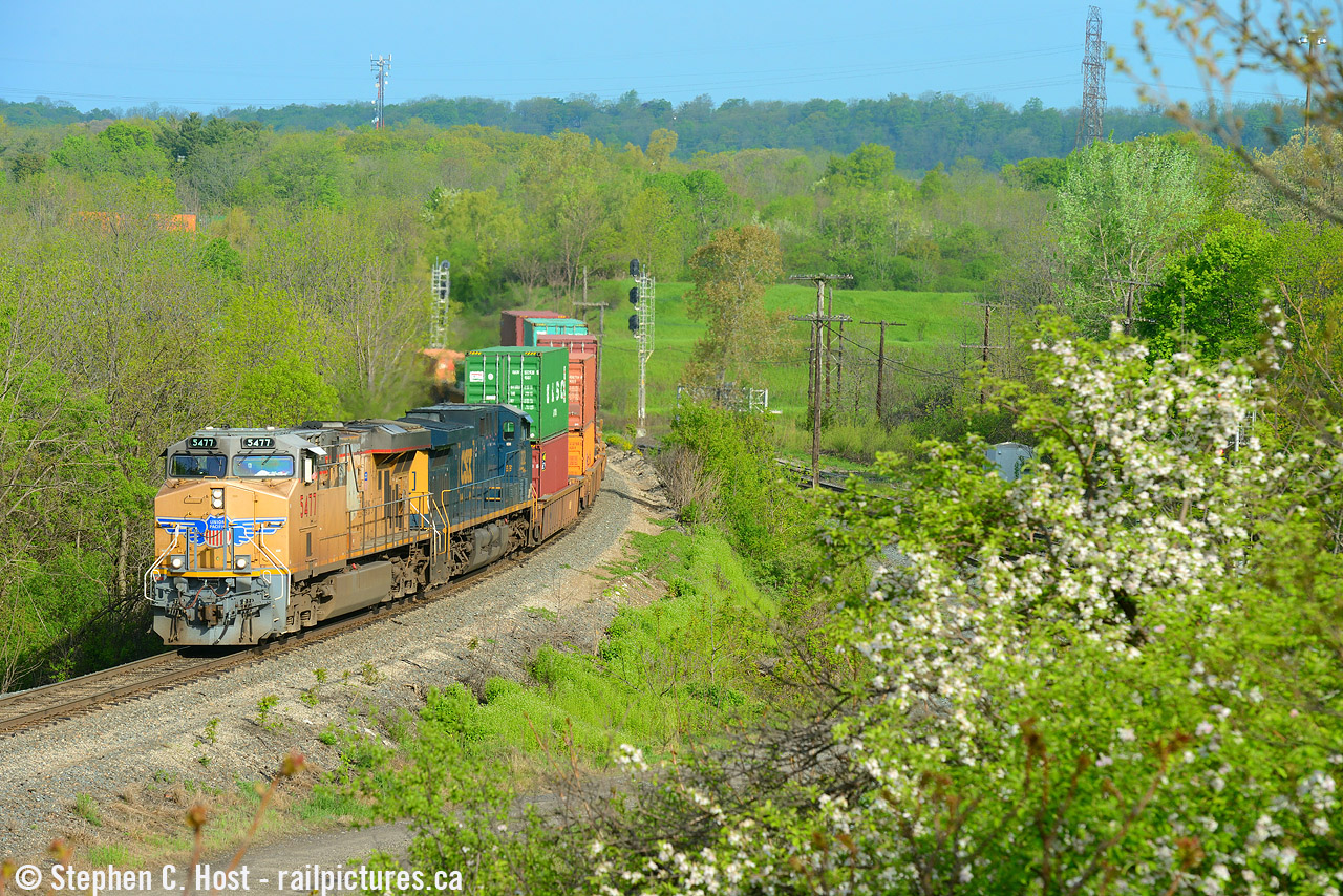 Sometimes you just get lucky. I checked ATCS and saw a southbound lined and decided, what the heck let's find a nice spring shot. I set up around Concession 7 near Carlisle and around the bend comes a suprise UP/CSX pair, so naturally, I followed it for a bit. Arriving at the bottom of the hill passing signs of Spring, 143's about to enter the CTC at Desjardins.