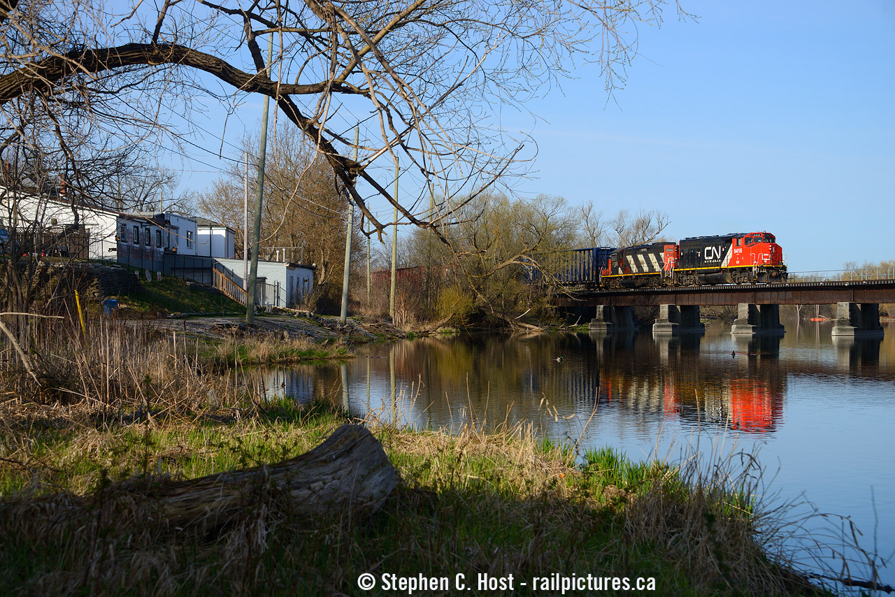 Crossing the speed River in Hespeler Ontario, L542 is trundling onward to Guelph after working customers on the Fergus sub and the Galt Industrial Spur. At left is the town of Hespeler, and you can see some gravel/ballasted roadway behind the houses - that was the former Grand River Railway Hespeler Subdivision which until the 1950's ran 14 scheduled passenger trains and 2 freight trains each way in only 3.6 miles. CP would continue to serve American Standard factory at the end of the line until the early 1990's - where after the 401 reconstruction closed the line they took out the automatic interlocking with the CNR and put in a switch to allow CN to service them instead. I don't know if they lasted until the GEXR days, but there was a crossbuck at Guelph Ave in the early 2000's that I remember. While the GRR may be gone, GEXR has come and gone and CN's still here.. surprisingly.