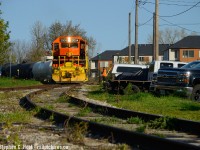 With a half dozen cars in tow, GEXR 583 has finished rounding the wye along Sackville St in Guelph, and will soon head on the south leg of the wye to head to the next customer.  Nearby is the ever present "northern rubber" factory where  signs of local industrialist James Walter Lyon's vision of development remain (Build industries, and housing nearby for workers - something we frown upon now).  An interesting mashup, houses and the railway right beside each other harkening back to a different time when folks didn't have cars and workers walked to work in nearby factories. Now, the folks just park on railway property with full city permission (it's signed!) This would have probably been one of Guelph's poorest neighbourhoods and kind of still is, but there are signs of gentrification all around as many of the pretty beat up looking  homes are being fixed up as well as the factories are currently turning to Condos in a flurry of construction. For now, the dichotomy between railway and housing continues and is worth a visit to see for yourself.
