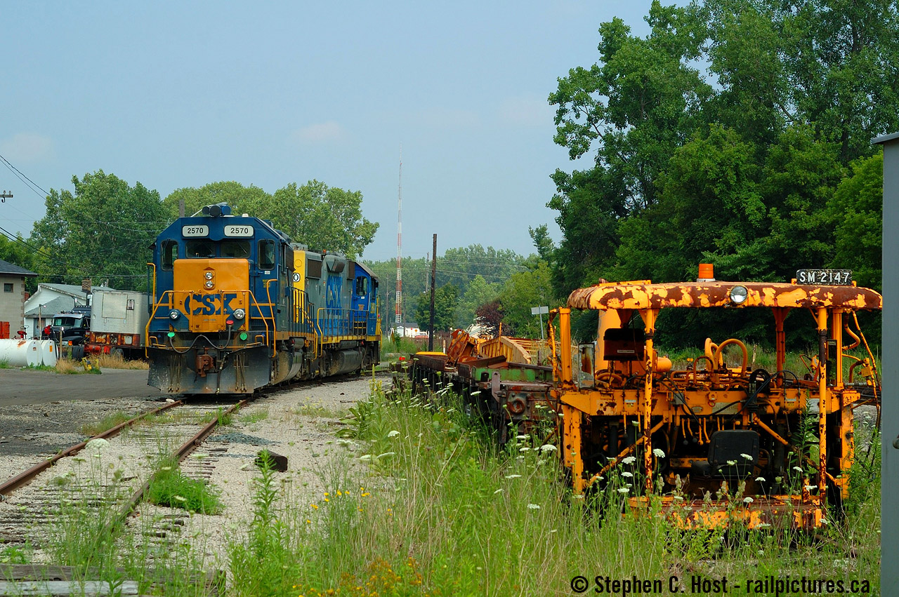 This is a rare photo for me, because in the few months that I followed the CSX Sarnia to Chatham turn this was the only time I arrived to find power actually sitting in Chatham already waiting for a D724 to Blenheim. Usually the power would be carried in the morning by D725 for a 1400 order time. Parked in the small yard that was located where the "roundhouse" (as they called it) was - it was a four stall engine house and between the roundhouse and this track was the mainline. Across a bridge in the distance was the station area and CP diamond, behind me is the CN diamond. After quickly exploring Chatham I went to the station where the clerk invited me in to cool off - it was *hot*. 
This was the place that time truly forgot - and Chatham truly manifested it - not only did CSX call out of here twice a week, there were three vehicles parked at the "roundhouse" for what? I don't know, but there were friendly CSX employees everywhere and now you'd be lucky to find two or three folks on duty up in Sarnia per shift. CP also had a yard job a few times a week out of Chatham, plus a very busy mainline, and not to mention CN's locals and pair of mainline trains at the time. A far cry from what goes on now. Add to it the copious amounts of visible MOW equipment that i'm sure Paul O'shell will enjoy (all of it had Chessie markings too, and still does to this day many of which you can still find in Sarnia). Here is  Geoff Elliott's shot from the same day as this was when I met him with his crew :)