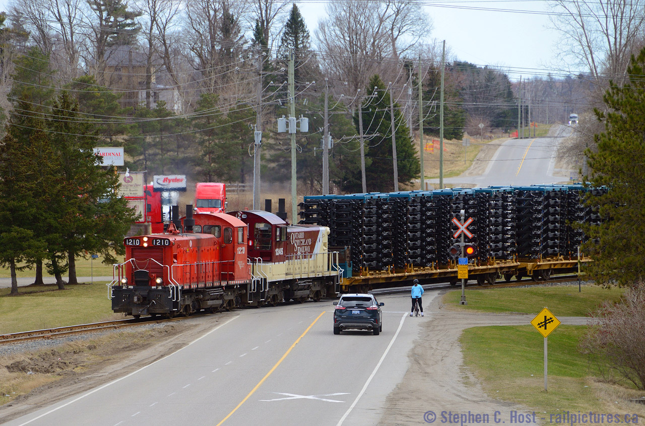 Multiple modes of transportation meet in Putnam Ontario as OSR re-routed Formet Industries frames from St. Thomas are brought to CN at Beachville due to a major rebuild of the Talbot sub. Unusual for OSR to handle Frame Traffic, this hadn't been seen on the St. Thomas Subdivision since 2009 when CP last hauled frames for the GM plant in Oshawa  (example pic of St. Thomas sub action under CP). The re-routes were necessary as CN lifted the Barwick St. Bridge track too high so frames could no longer clear the L&PS built structure, and GM needs frames daily to produce cars, so OSR was called in to help for a few days while CN fixed their major mistake.