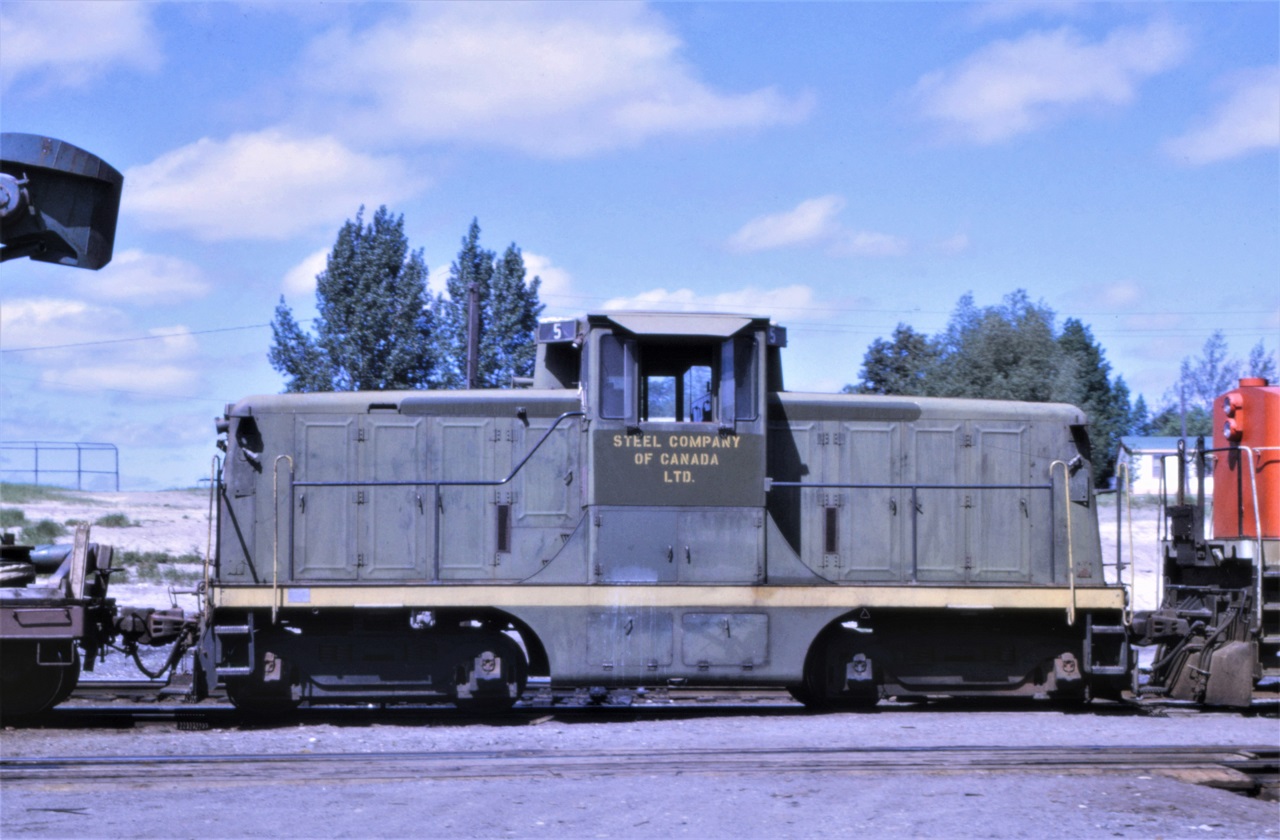 Steel Company of Canada GE44 tonner #5, formerly CN #5, passes through Capreol, Ontario in June 1969 on its way to its new home in Welland, ON.
