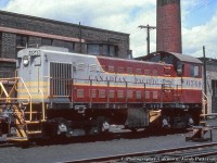 CPR S3 6549 sits at Lambton roundhouse outside the motive power office building (note bay window), which housed the “General Locomotive Foreman, the Shop Foreman, Boiler Foreman, the crew clerks,” and various other positions.  It also contained a booking-in room for engine crews.  The smokestack at right is attached to the boiler room off the machine shop.  Building info per Ray Kennedy.<br><br><i>Original Photographer Unknown, Jacob Patterson Collection Slide.</i>
