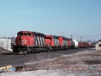 CN 5247, CN 5049, and an unidentified SD50F/60F roll through Woodstock with a westbound freight on March 12th, 1995