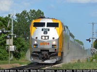 VIA Train #73 "kicks it up" as it hits the 1st Street crossing while speeding through Belle River, Ontario on June 3, 2022 on it's way to Windsor.