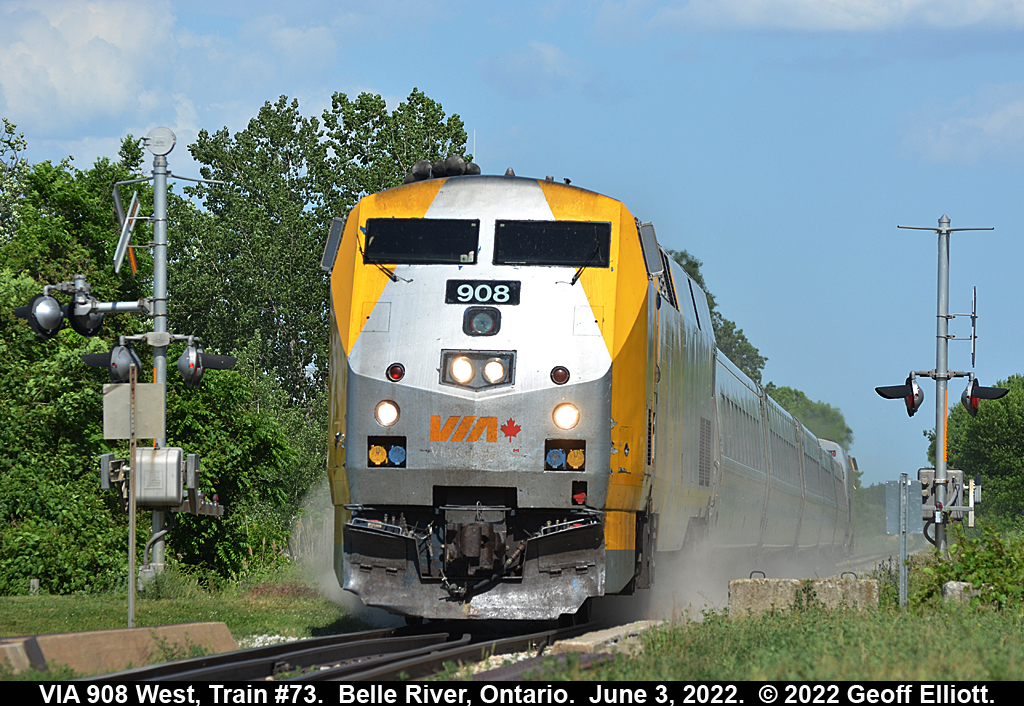 VIA Train #73 "kicks it up" as it hits the 1st Street crossing while speeding through Belle River, Ontario on June 3, 2022 on it's way to Windsor.