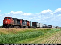 CN 8910 West, Train #439, gets underway after meeting VIA train #76 at Stoney Point, Ontario.  Thankfully 439 was a short train today as they were stopped in Stoney Point for about a 1/2 hour and would have had the town tied up as school let out if they had been about 5 cars longer.