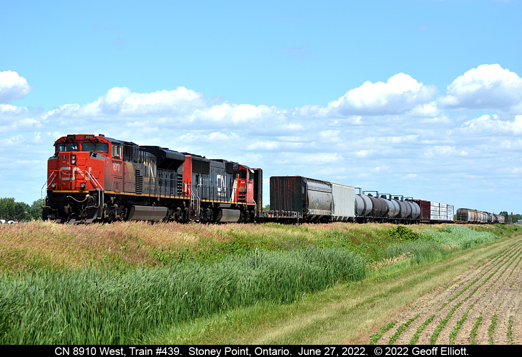 CN 8910 West, Train #439, gets underway after meeting VIA train #76 at Stoney Point, Ontario.  Thankfully 439 was a short train today as they were stopped in Stoney Point for about a 1/2 hour and would have had the town tied up as school let out if they had been about 5 cars longer.